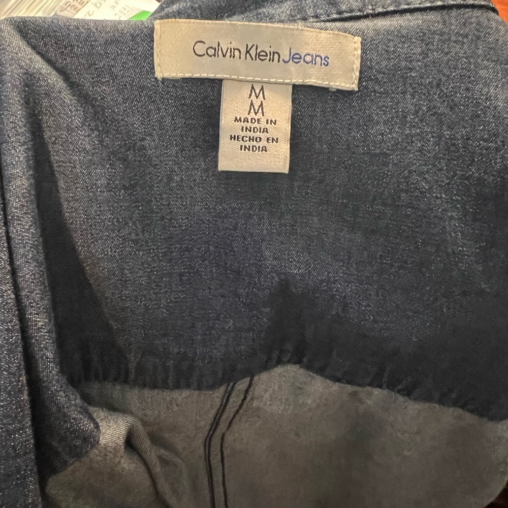- Calvin Klein denim long sleeve top with snaps in front. - Picture 5 of 6